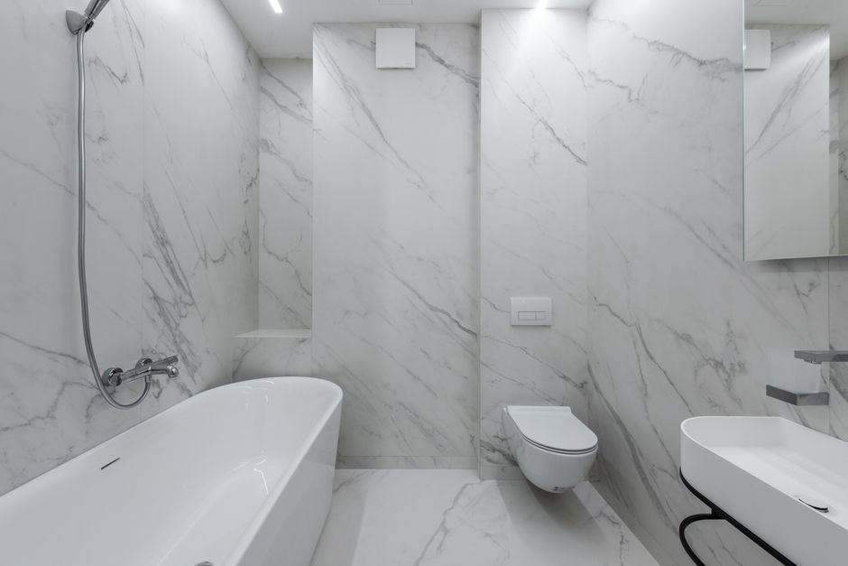 Professional installing bathroom tiles
